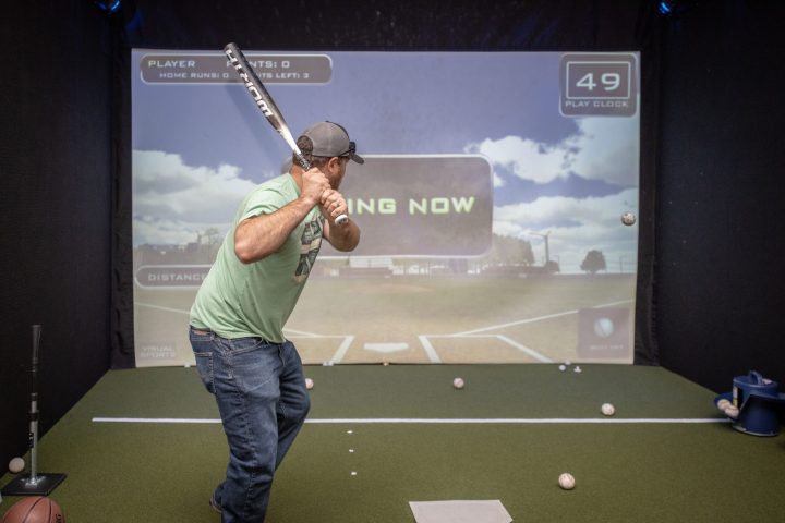 a man standing in front of a screen